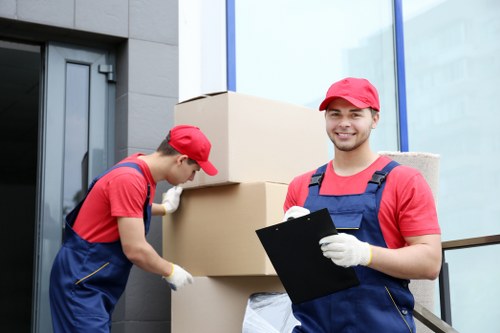 Moving team handling furniture in a busy South London area