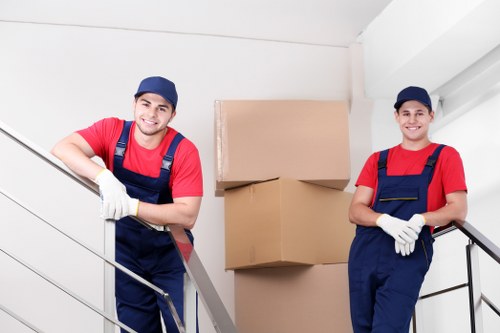 Packed household boxes and furniture ready for man and van transport