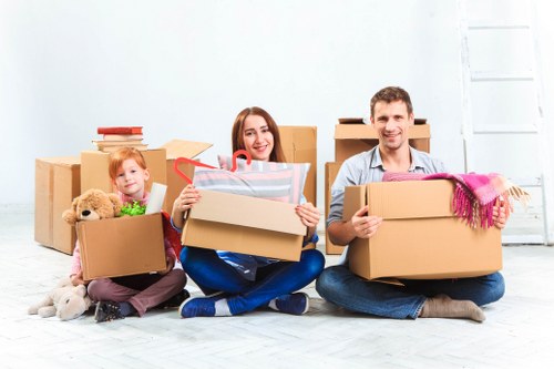 Packed moving boxes and furniture ready for local transport