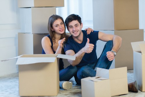 Removal team handling boxes and household items in South London