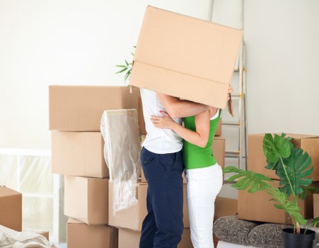 Packed moving boxes ready for transport in a London flat