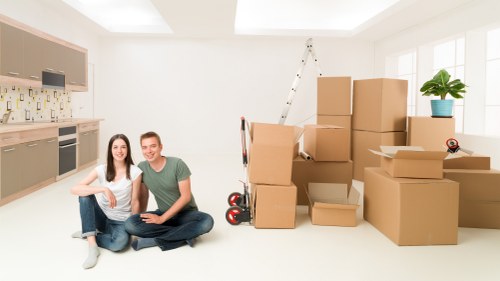 Professional movers assessing items and access for a safe relocation