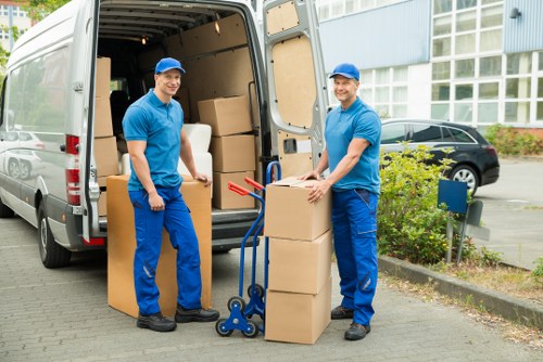 Careful loading of household items into a moving van