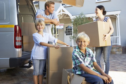 Local removal van helping customers move from a London apartment building