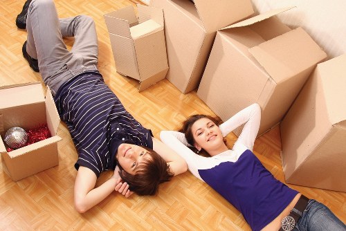 Professional movers loading items outside a South London flat
